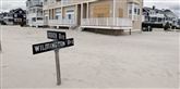 <span style='font-family: Arial; font-size: 15px; color: White;'>En gade i New Jersey er begravet i sand efter Sandy.</span> <span style='font-family: Arial; font-weight: normal; font-size: 15px; color: #999999;'>Foto:  (AP Photo/Mel Evans) / POLFOTO</span>