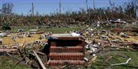 Her stod engang et hus! Ødelæggelserne efter en sværm af tornadoer i Midtvesten i USA.