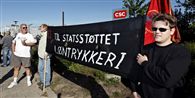 "Vi giver det hele, og vi får ingenting. Det er det, vi kalder diktat," siger Joan Falck Nielsen fra de strejkendes pressegruppe.