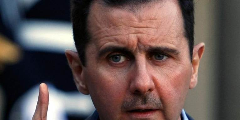 Kina og Rusland har nedlagt veto mod en resolution, der støtter Den Arabiske Ligas krav om, at Syriens præsident Bashar al-Assad træder tilbage.