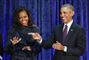 Michelle og Barrack Obama griner