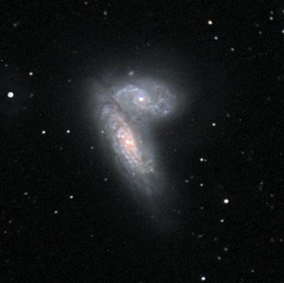 Billede af to galakser tæt op ad hinanden.