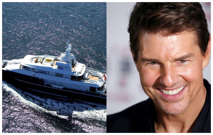 En megayacht og en smilende mand