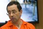  Larry Nassar med orange tøj