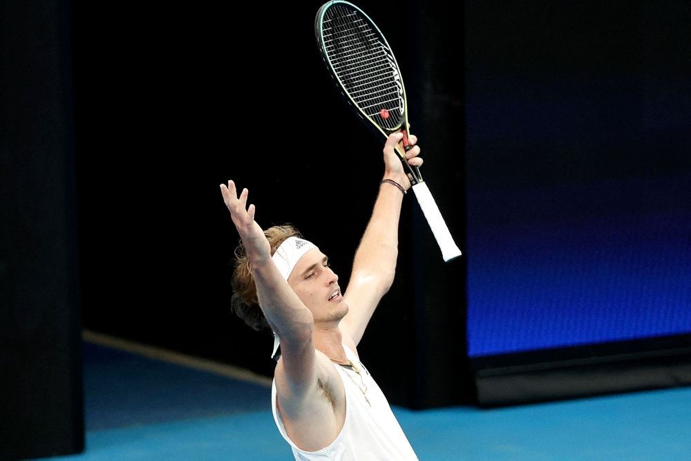 en tennisspiller jubler  på banen