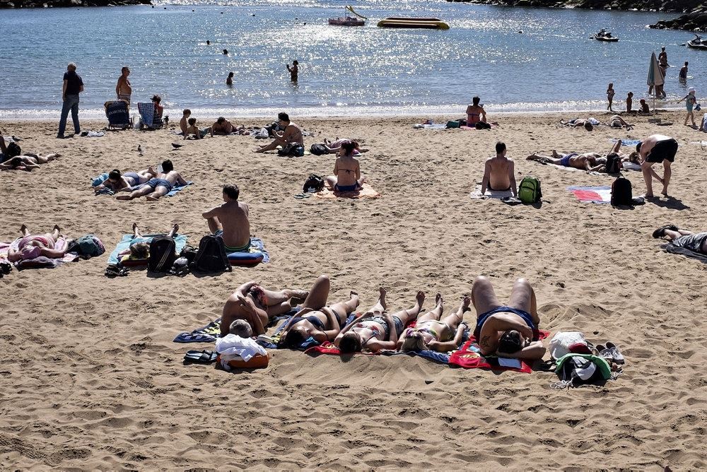 folk på strand