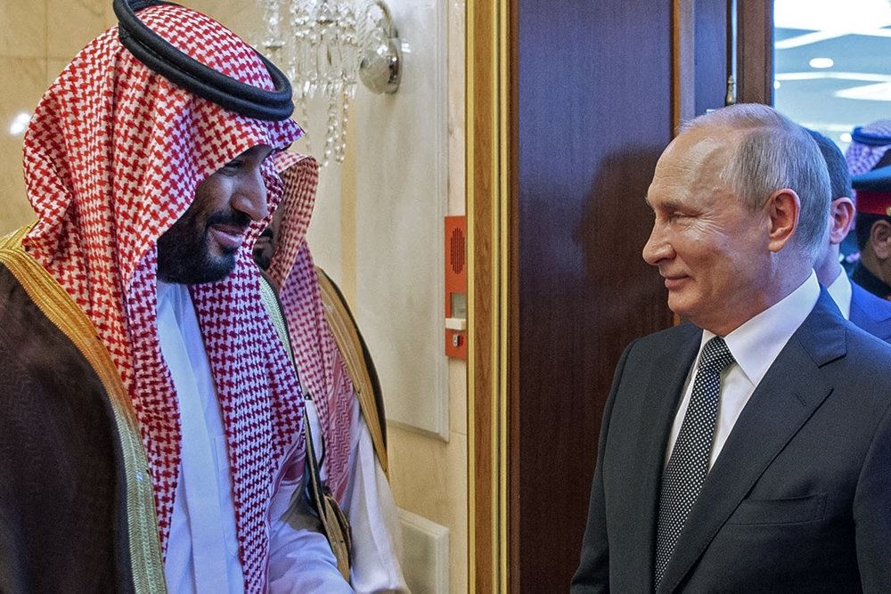 Putin og en sheik smiler
