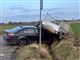 to biler og trailer ligger i grøften