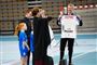 Mary og Frederik i en sportshal med nogle spillere